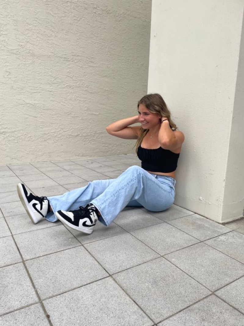 Black Sneaker Fashion Outfits With Black Crop Top And Light Blue Casual Trouser: 
