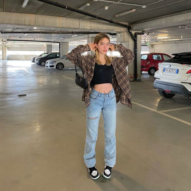 Light-Wash Jeans, Black Crop Top, Plaid Overshirt, and Black & White Slip-On Vans: automotive lighting,  automotive tire,  vehicle door,  jordan 1 high obsidian  