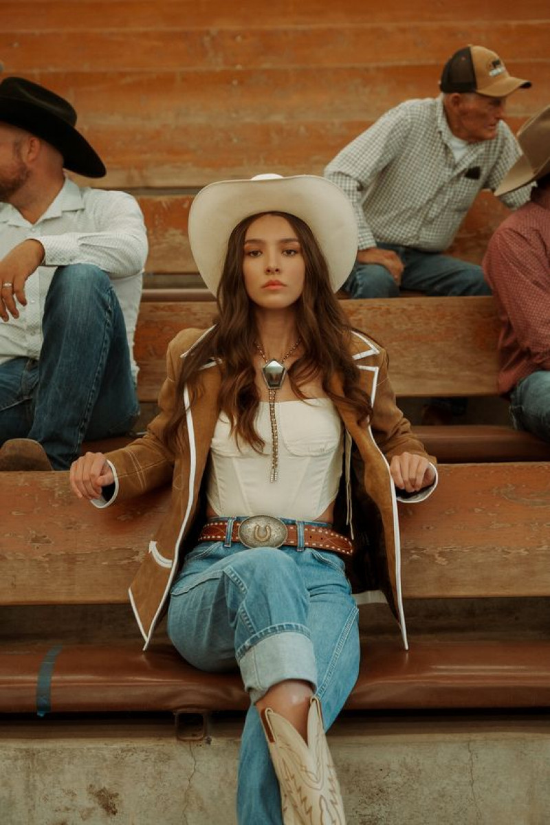 White Shirt Cowgirl Fashion Clothing Ideas With Light Blue Jeans, Sitting: sun hat,  rodeo ready blazer  