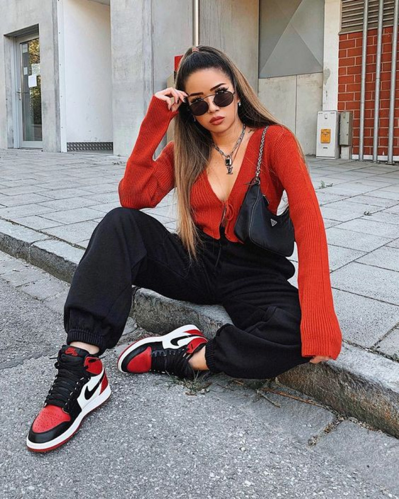 Red And Black Jordan Sneaker With Black Sweat Pant And Red Top, For Comfortable Sexy Look: jordan brand air jordan 1 mid,  nike air  