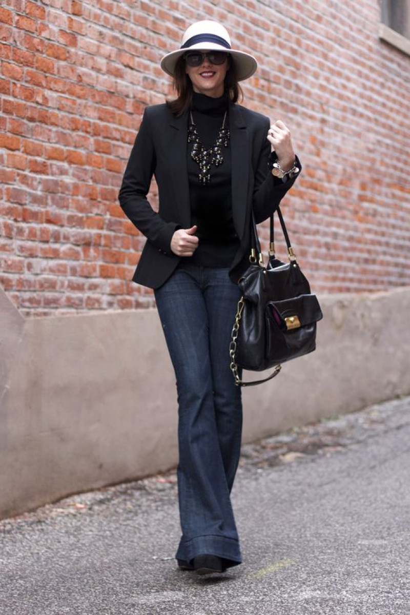 Dark Blue And Navy Boot Cut Jeans Outfit Trends With Black Blazer, And Statement hat: 